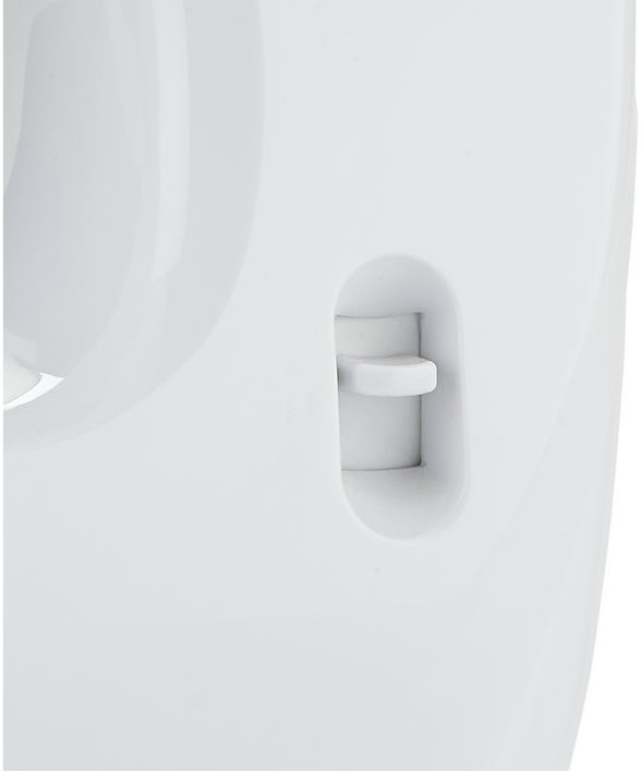 Close-up of a white plastic object with a small button.