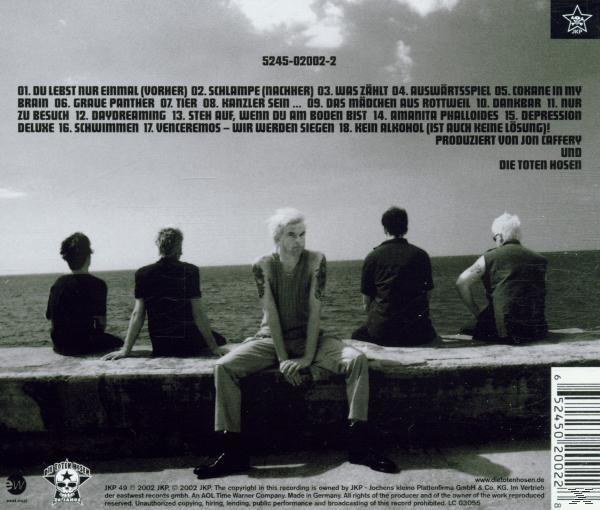 Rückseite des Albums. Fünf Personen auf einer Mauer, blicken aufs Meer. Text auf Deutsch.