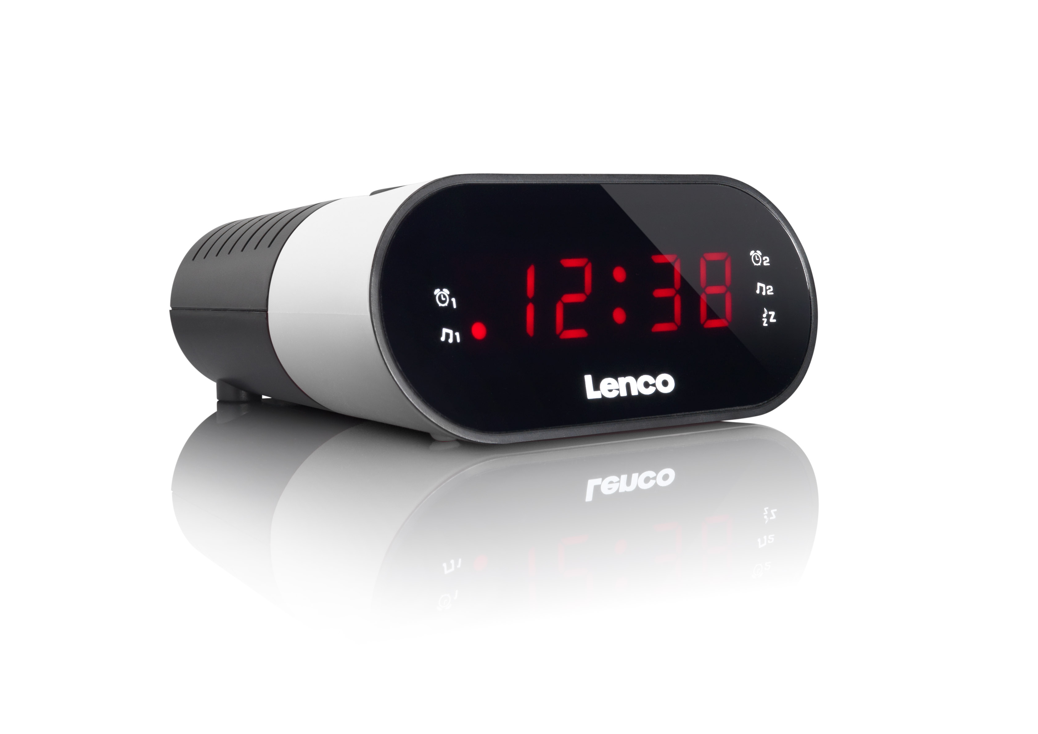 Digital clock displaying 12:38 in red digits. Black, white and gray case, with a light reflection below.