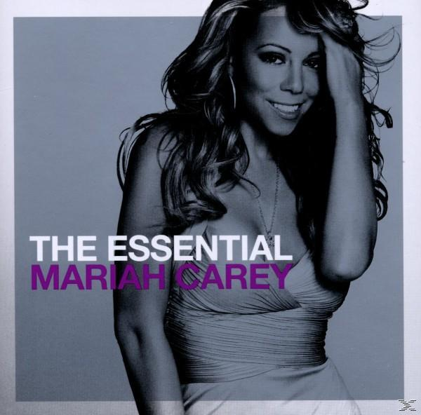 Albumcover von Mariah Carey. Sie lächelt, trägt ein Kleid. Text: 'The Essential Mariah Carey'.