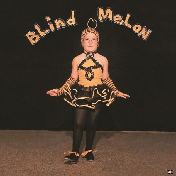 Egy gyermek méhruhában, felette a "Blind Melon" felirattal. A háttér fekete.