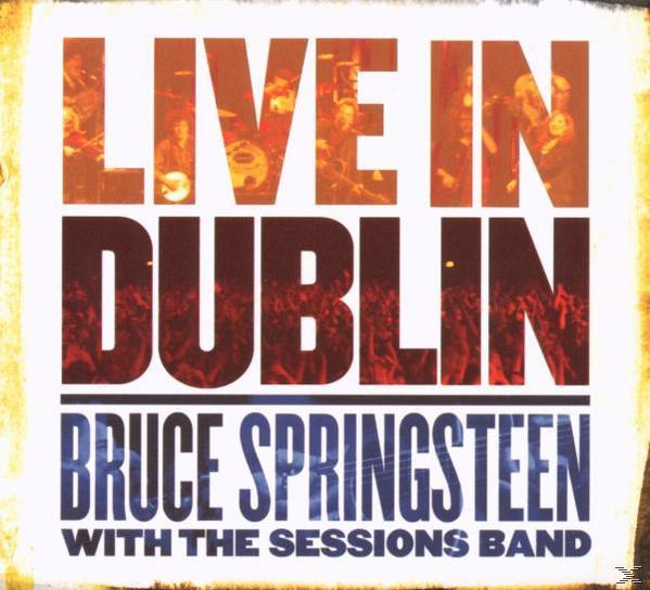 Albumcover: Live In Dublin von Bruce Springsteen. Text über einer verschwommenen Menschenmenge in einem Konzert.
