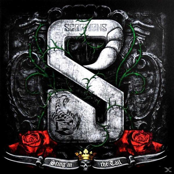 Albumcover für Scorpions, ein großes silbernes 'S' mit einem Skorpion und Rosen, umgeben von einem verzierten Hintergrund.