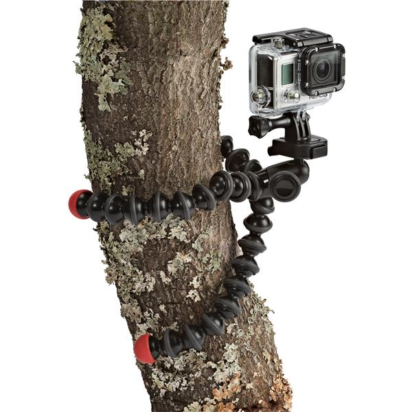 GoPro camera mounted on a flexible tripod attached to a tree trunk. Red and black design.