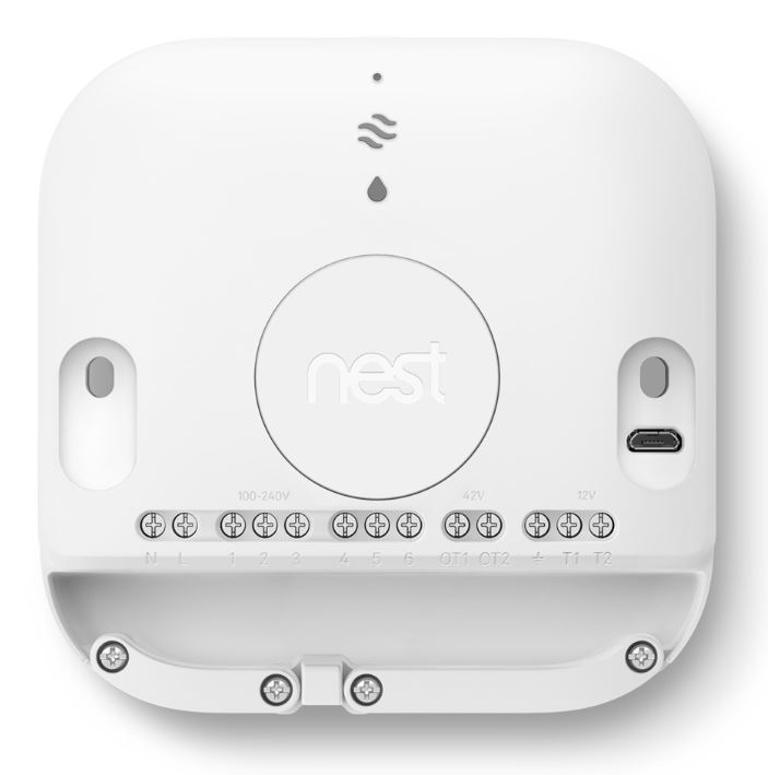 Witte Nest-thermostaat met labels. Het heeft een centrale draaiknop, een Nest-logo en diverse aansluitpoorten.