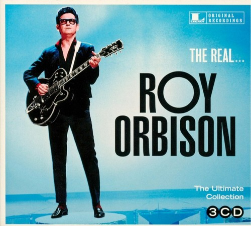 Albumcover für Roy Orbison. Er hält eine Gitarre, trägt eine Sonnenbrille und einen Anzug, vor blauem Hintergrund.