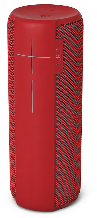 Roter zylindrischer Lautsprecher mit schwarzem Mesh und weißem kreuzförmigem Bedienelement.