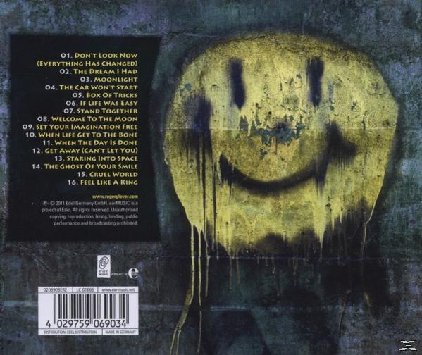Album borító. Sárga smiley graffit a szürke falon. A dalok címei fel vannak sorolva.