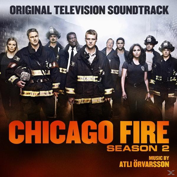 A Chicago Fire 2. évad DVD-borítója egy csoport tűzoltóval.