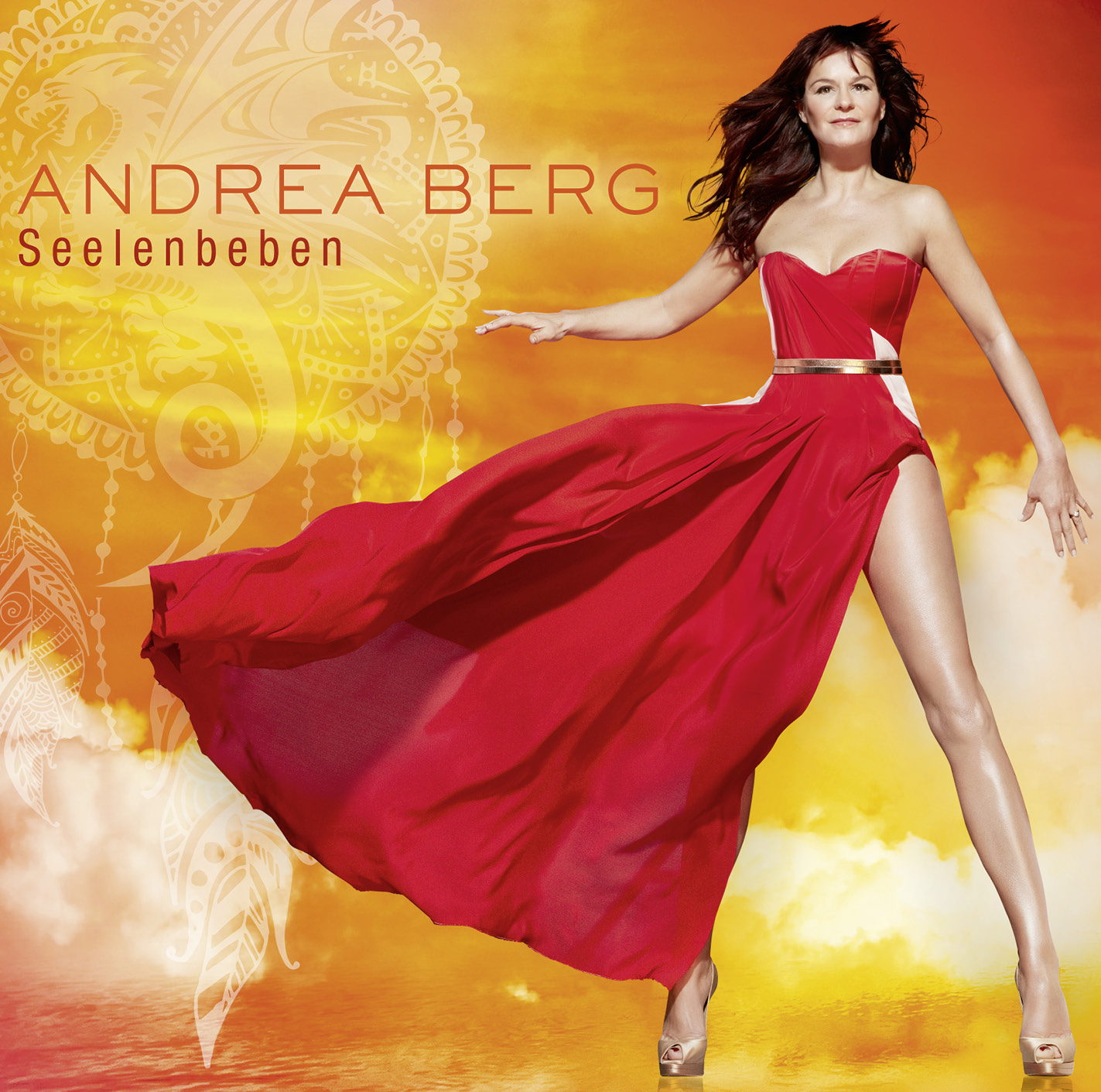 Albumcover: Frau in rotem Kleid mit Text 'Andrea Berg', 'Seelenbeben' und einem Traumfänger.