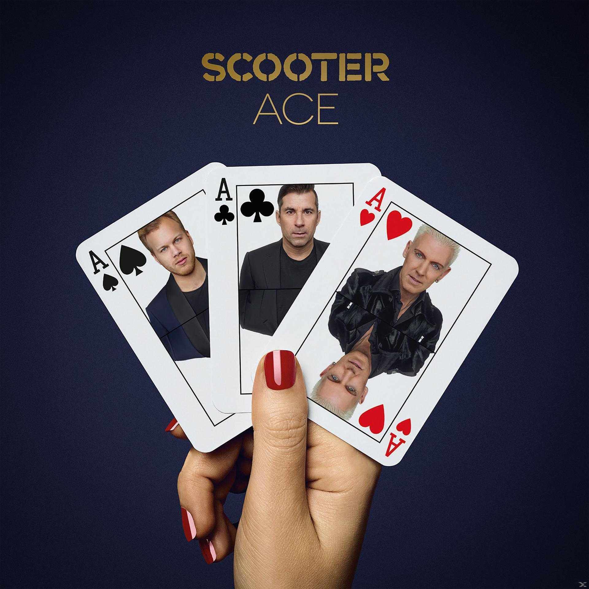 Scooter album borító. Három kártya. Pikk, treff és kőr ászok. Egy nő keze.