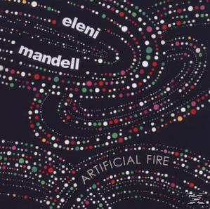 Albumcover mit Text: "eleni mandell", "ARTIFICIAL FIRE" und bunten Punkten auf dunklem Hintergrund.