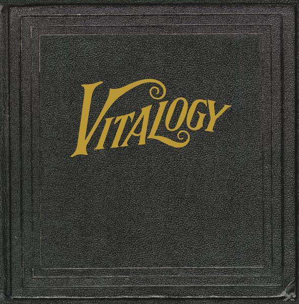 Albumcover in Schwarz mit goldenem Text 'Vitalogy'. Das Cover hat ein strukturiertes Design mit dunklem Hintergrund.