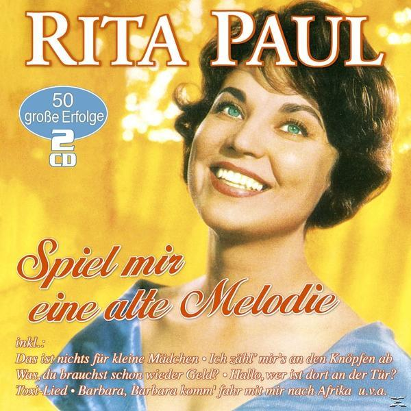 Albumcover von Rita Paul, lächelnd mit Textüberlagerung.