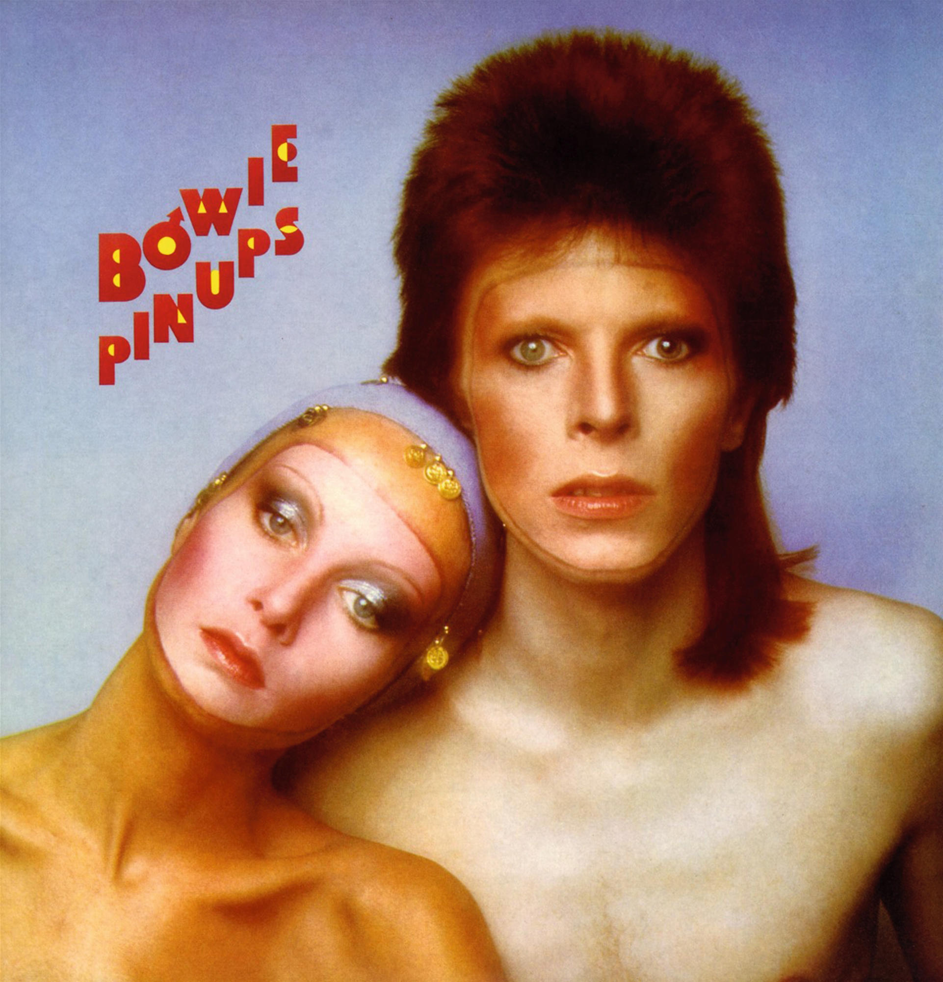 Albumcover mit zwei Personen. Einer ist geschminkt und hat Haare. Der andere ist oben ohne.
