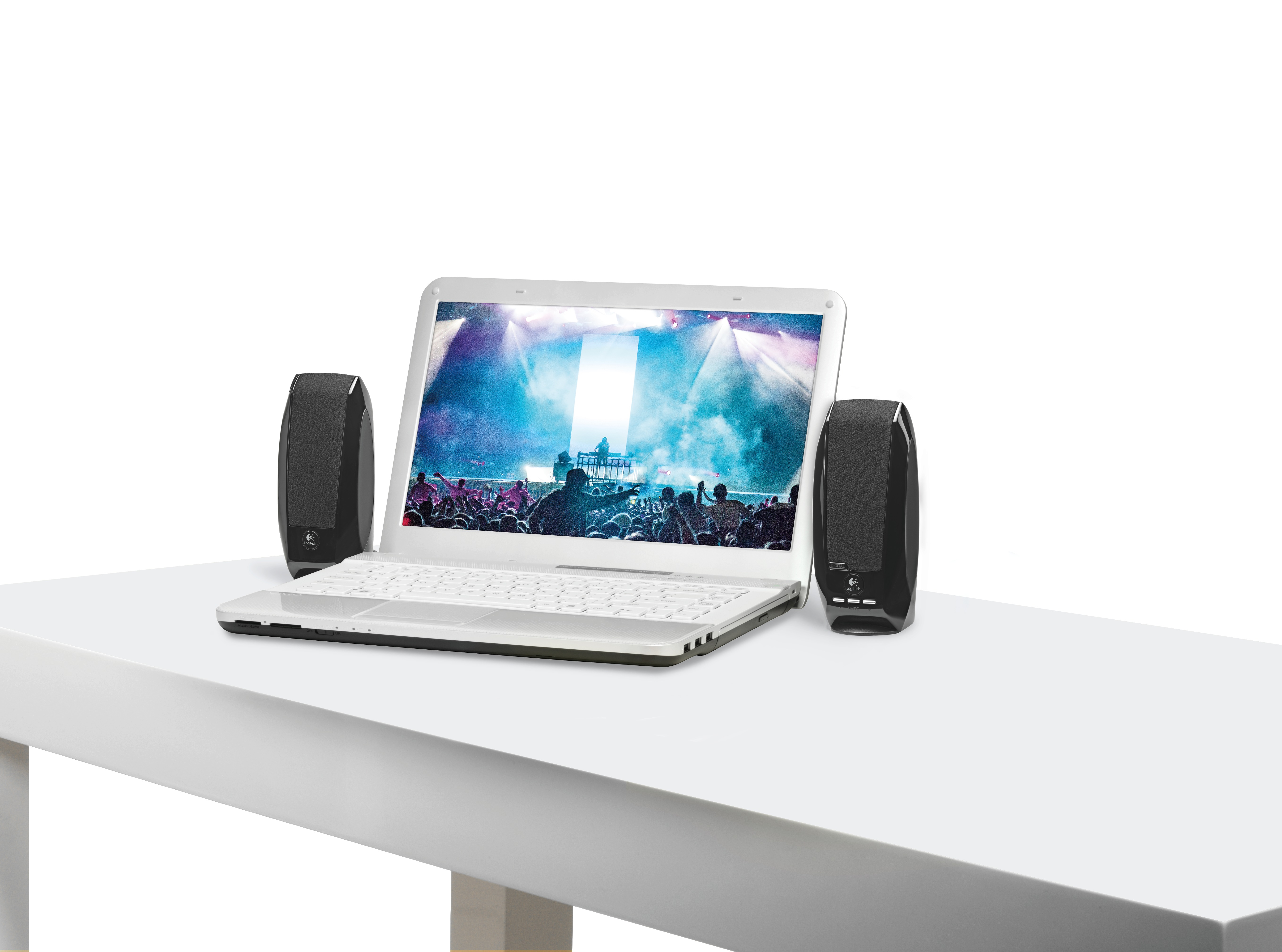 Laptop with speakers. Screen shows a concert with a crowd. Speakers on the sides of the laptop. White background.