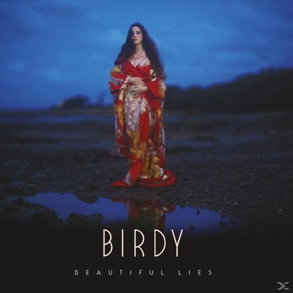 Birdy album borító. Nő piros és arany ruhában a vízben áll, éjszakai égbolt.