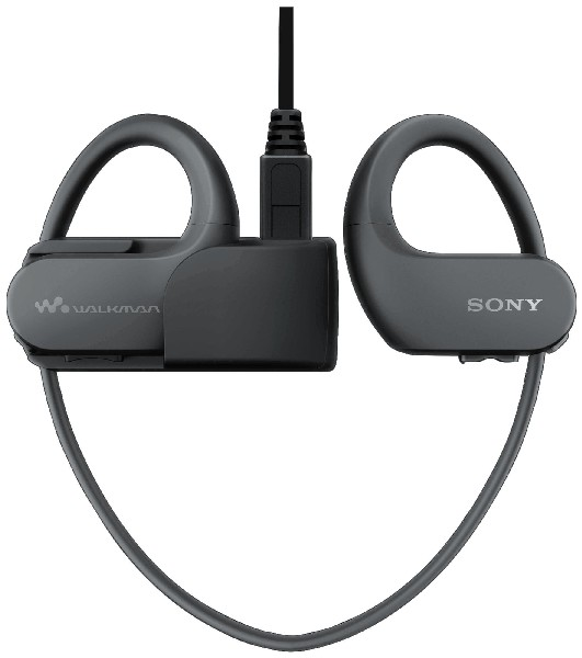 Auriculares inalámbricos negros y grises. La estación de carga está en el medio.