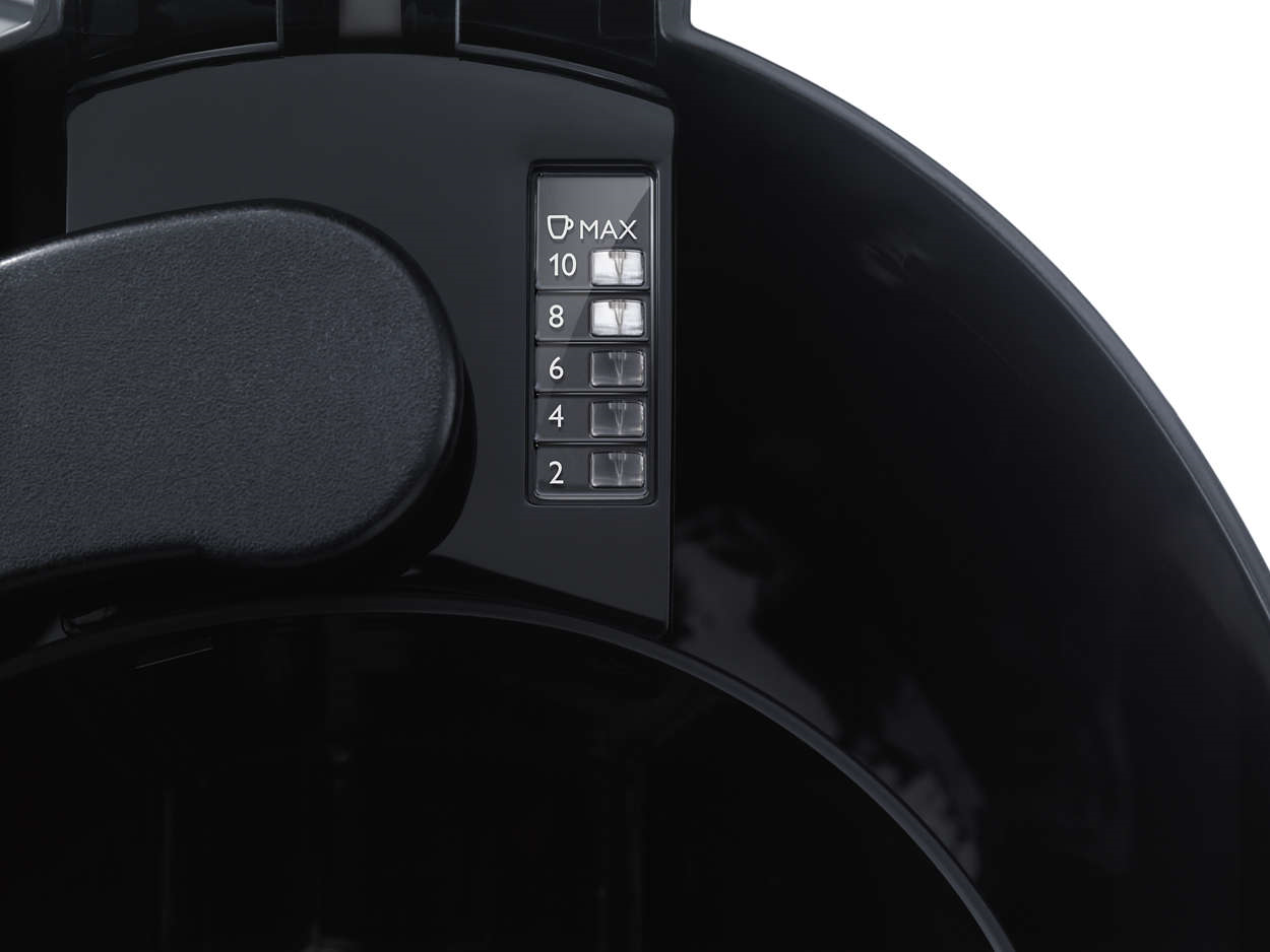 Close-up of a black coffee maker, with a scale showing the number of cups: 2 to 10.