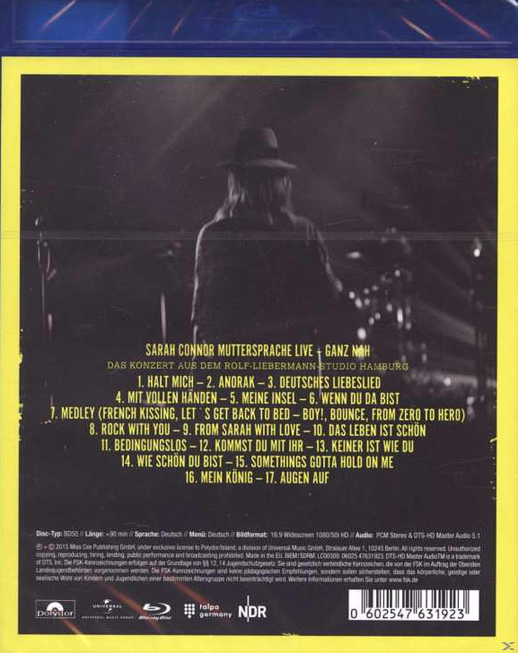 Die Rückseite einer CD mit Titelliste und einer Silhouette einer Person auf der Bühne.