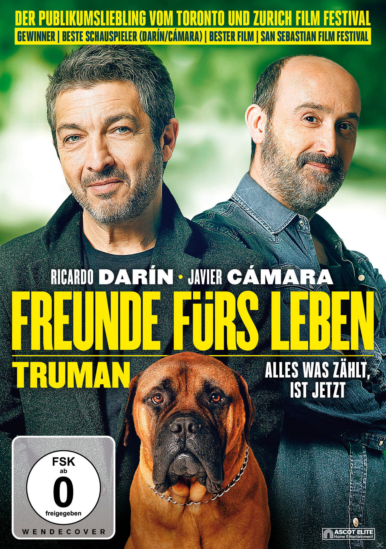 DVD-Cover: Zwei Männer, ein Hund und Filmtitel auf Deutsch, mit rotem und braunem Hintergrund.