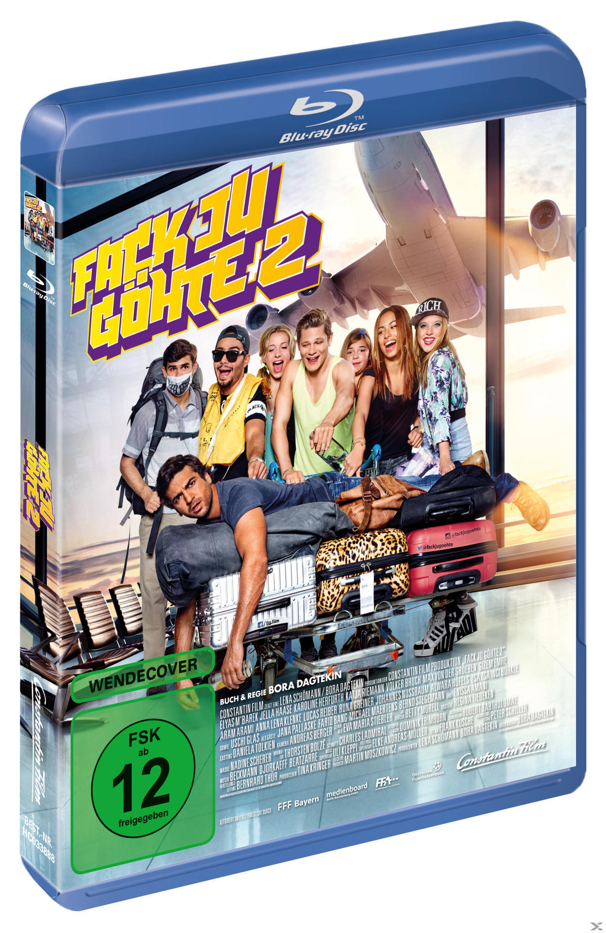 Blu-ray-Filmhülle: 'Fack Ju Göhte 2'. Zeigt eine Gruppe von Leuten vor einer Flughafenkulisse.
