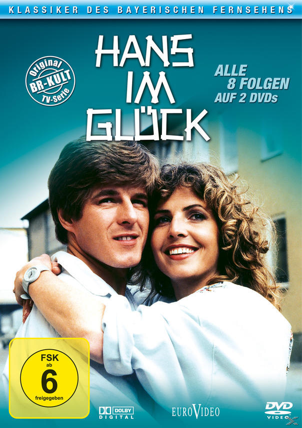 DVD-Cover mit lächelndem Paar. Titel: Hans im Glück. FSK 6. Hintergrund ist ein Haus und Bäume.