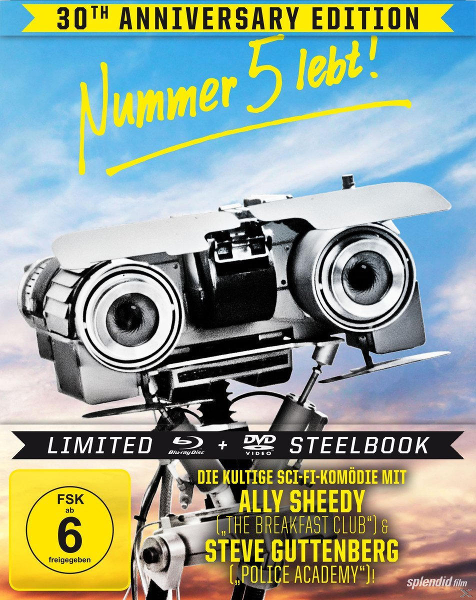 Filmcover: Short Circuit Roboter mit Text "Nummer 5 lebt!" und Schauspieler, blauer Himmel.