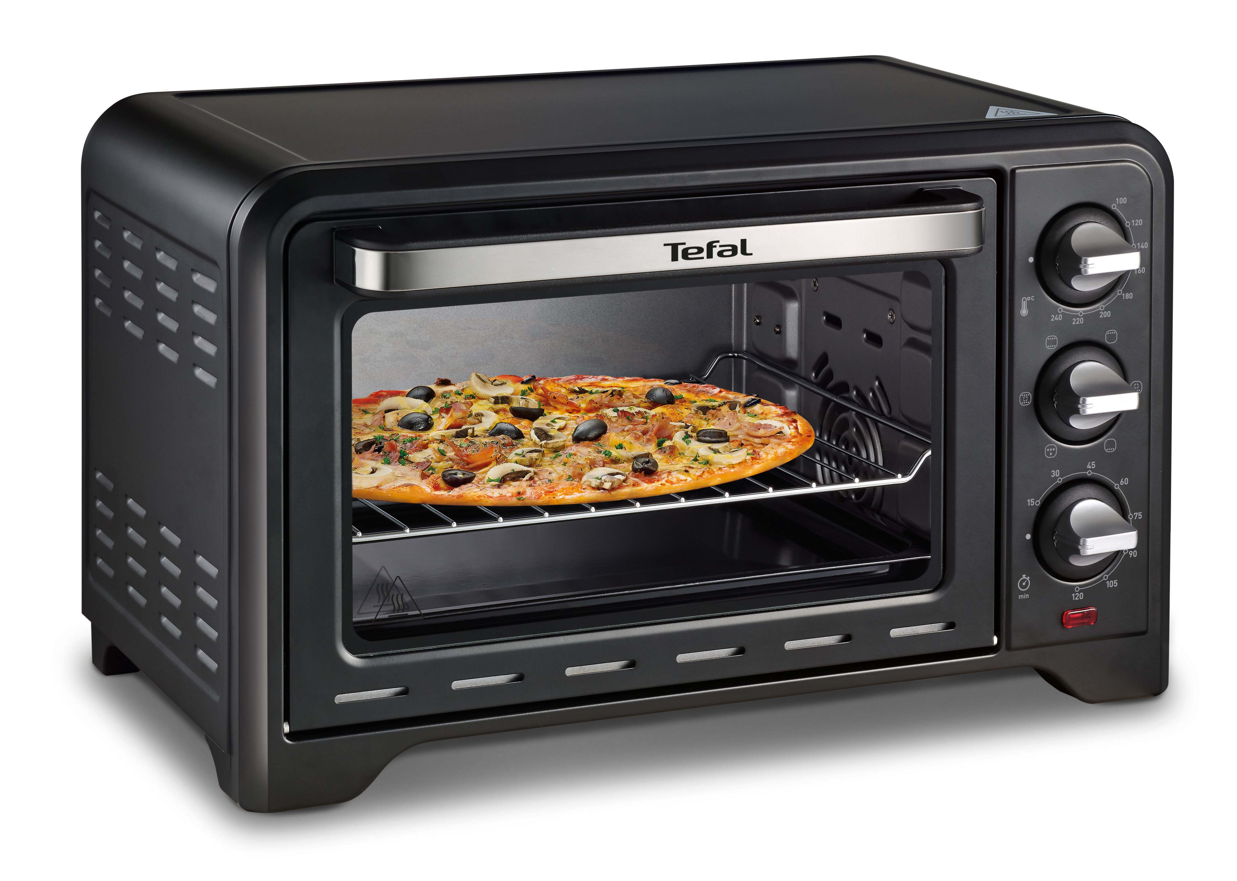Zwarte Tefal mini-oven met een pizza erin, aan het bakken. Bediening zichtbaar.