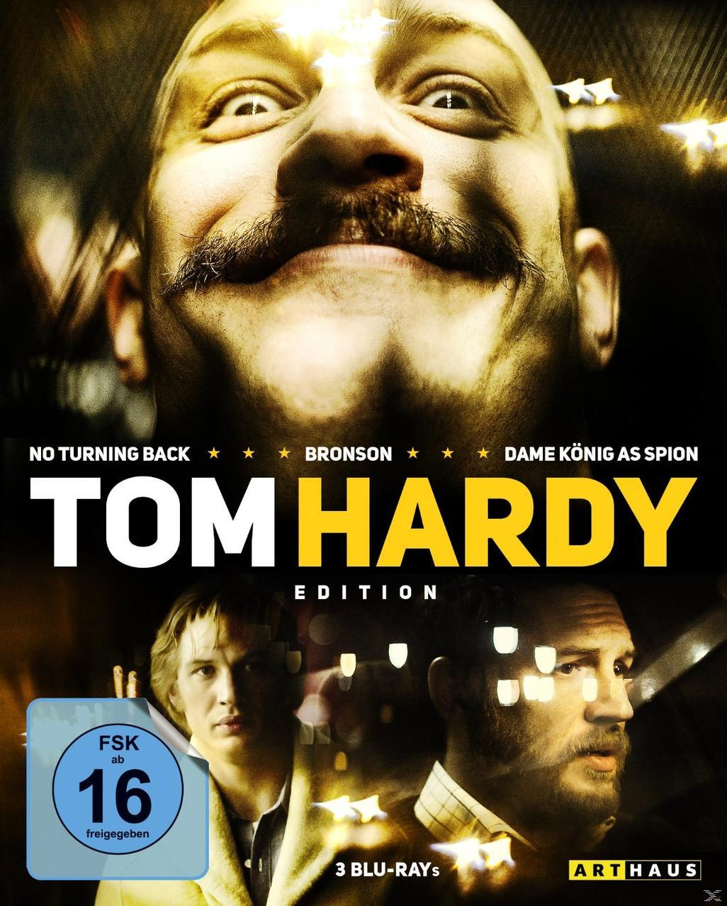 Filmposter: Tom Hardys Gesicht, lächelnd. Text: Tom Hardy Edition. Andere Gesichter sind im Hintergrund.