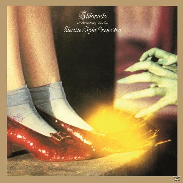 Albumcover: Beine mit roten Schuhen und eine grüne Hand, die sich mit einer gelben Explosion ausstreckt.