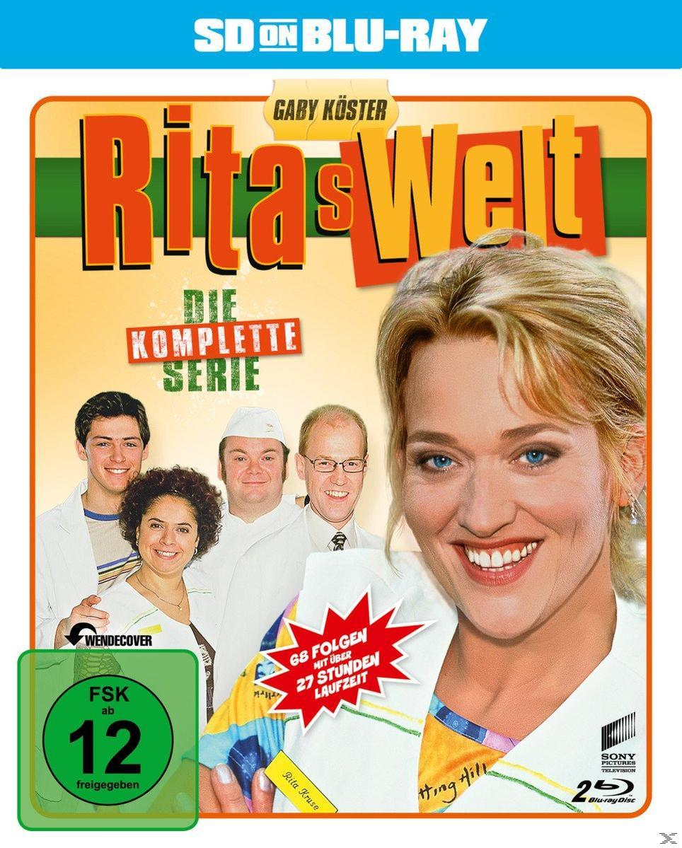 DVD-Cover von 'Rita's World', Gaby Köster lächelt vor einem Cast-Bild. Text und Logos sind auf dem Cover.