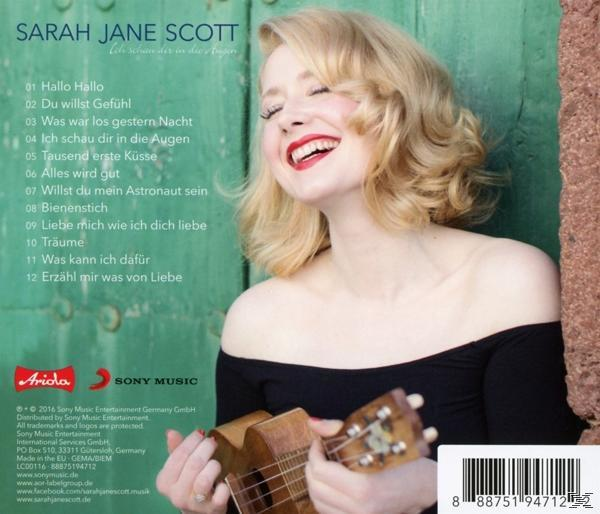 Albumcover. Blonde Frau mit Ukulele, lächelnd. Grüne Tür im Hintergrund. Text listet Songtitel auf.