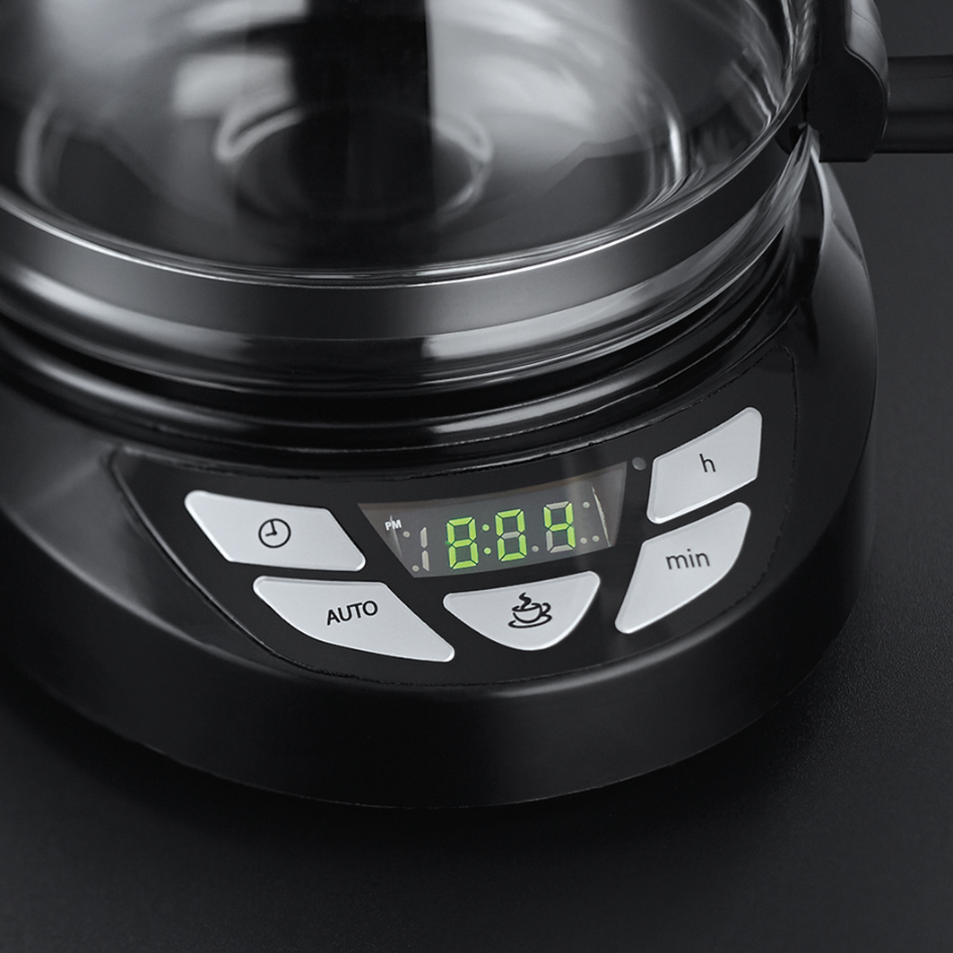 Close up of black coffee maker with a digital display showing time. Buttons are below the display.