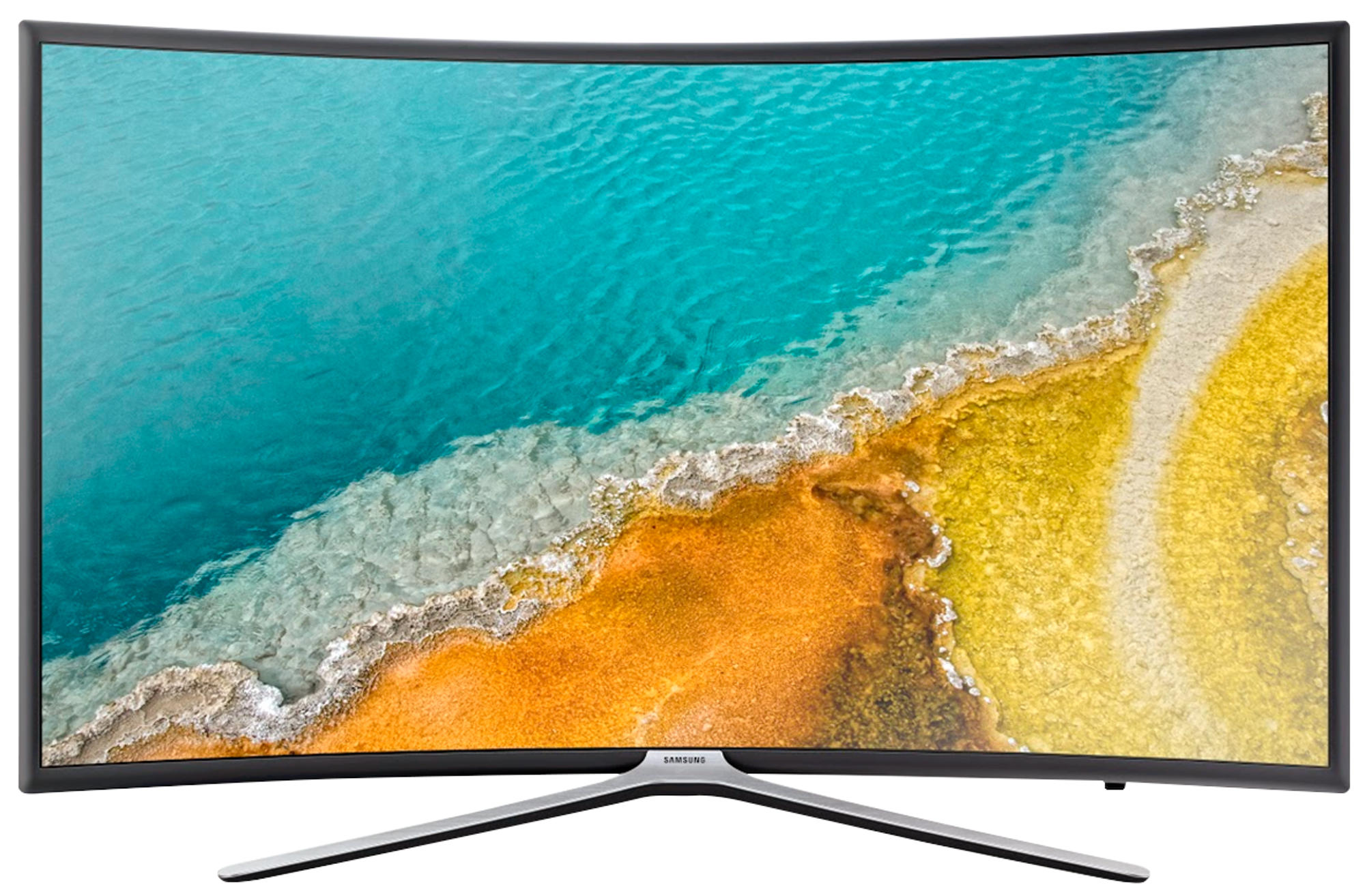 Gebogener Bildschirm-TV, der eine Küstenlandschaft mit blauem Wasser, gelbem Sand und einem silbernen Ständer zeigt.