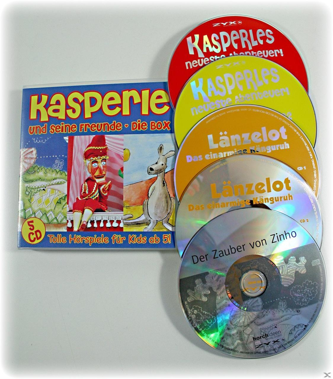 CDs und ein Buch einer Zeichentrickfigur, eines Kängurus und Zeichentricktieren auf weißem Grund.