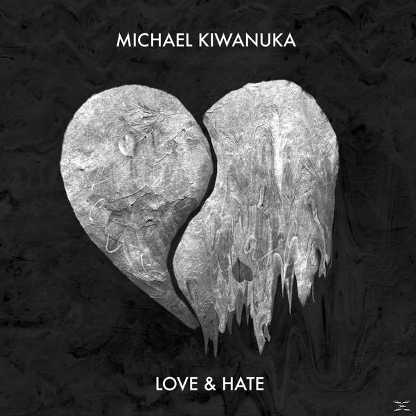 Albumcover: Michael Kiwanuka 'Love & Hate'. Ein gebrochenes Herz in Grautönen auf dunklem Hintergrund.