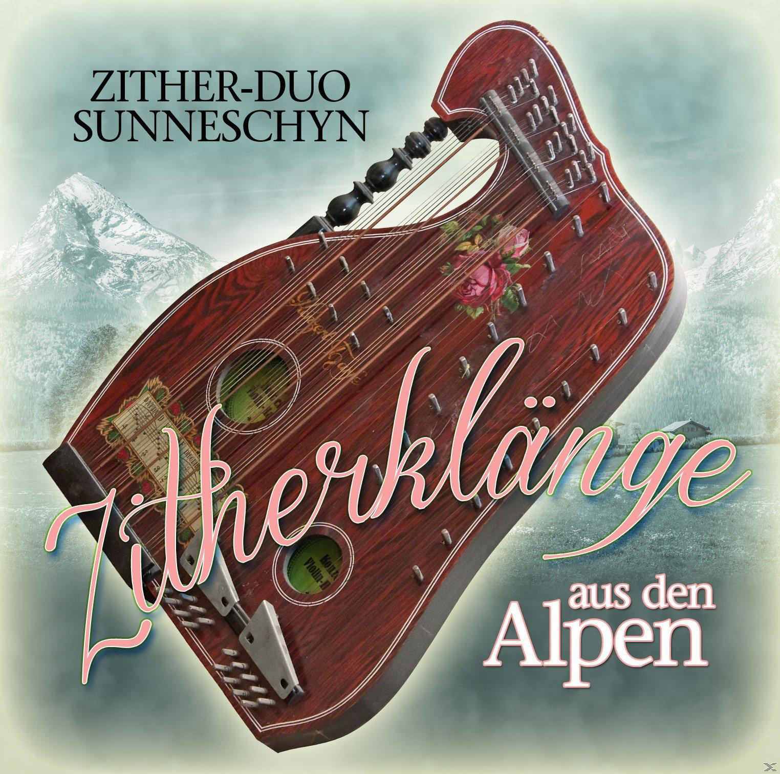 Albumcover für Zitherklänge aus den Alpen, mit einer Zither und einer Berglandschaft.