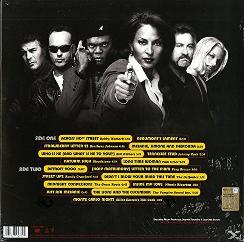 Albumcover mit verschiedenen Figuren. Eine Frau zielt mit einer Waffe. Eine Gruppe von Männern steht hinter ihr.
