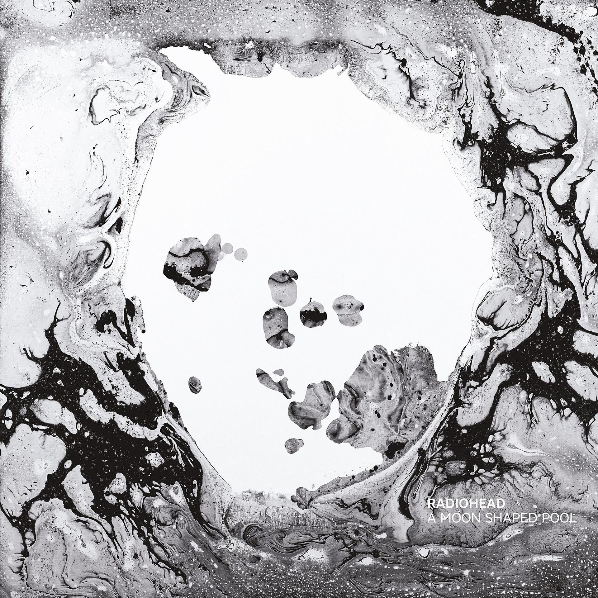 Radiohead album borító fekete-fehér örvényekkel egy fehér központ körül.