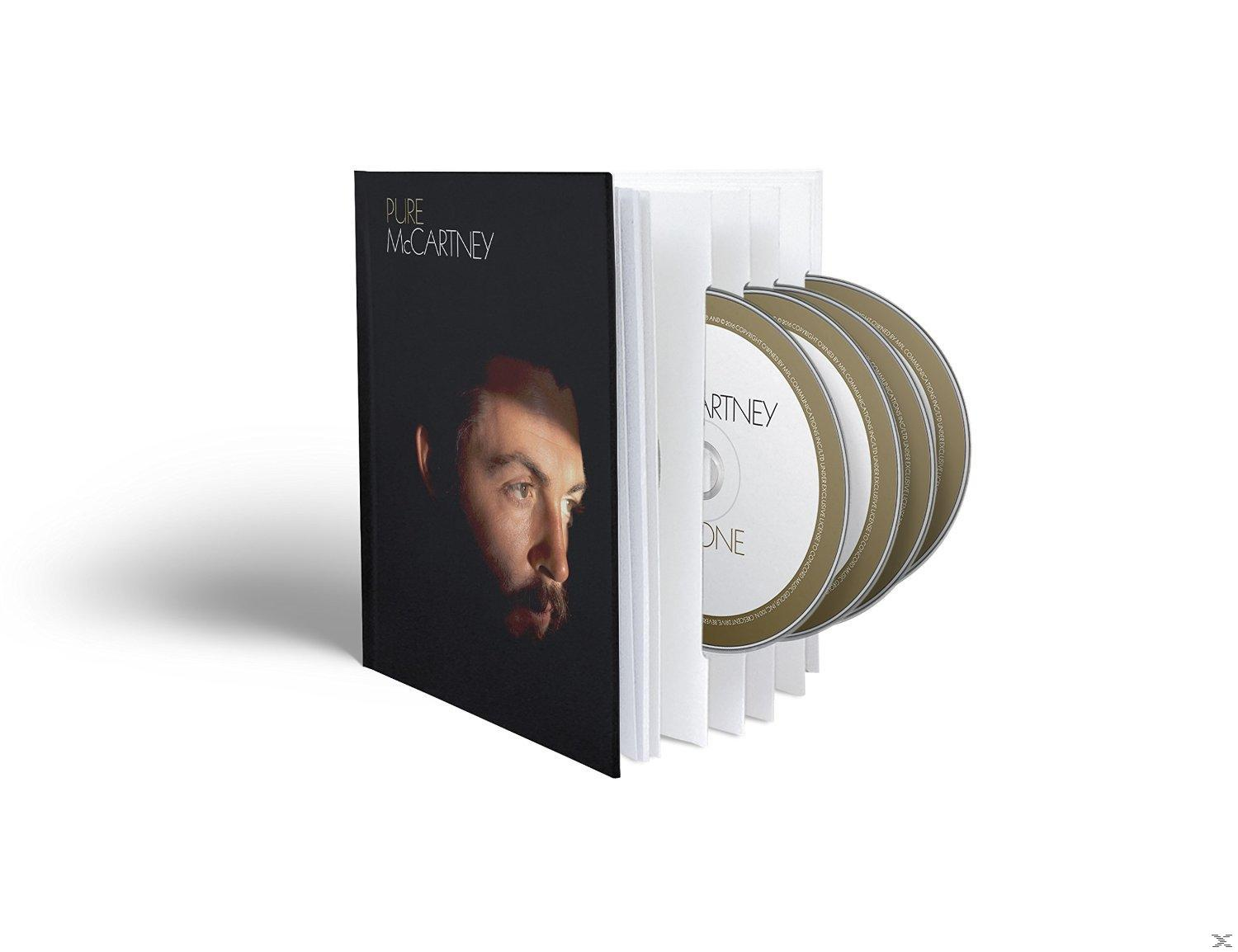 CD-Box-Set des Pure McCartney Albums. Das Cover ist schwarz mit McCartneys Gesicht. Drei CDs sichtbar.
