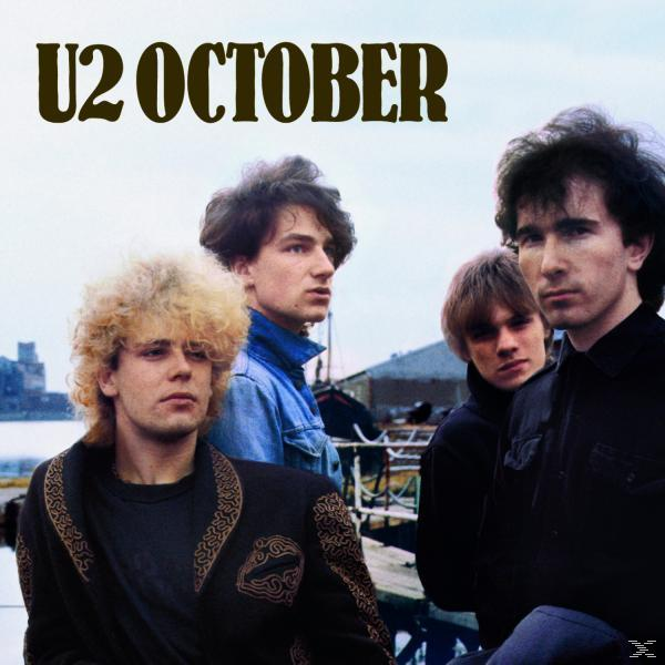U2 October Albumcover. Vier Bandmitglieder mit dem Titel 'U2 OCTOBER' darüber.