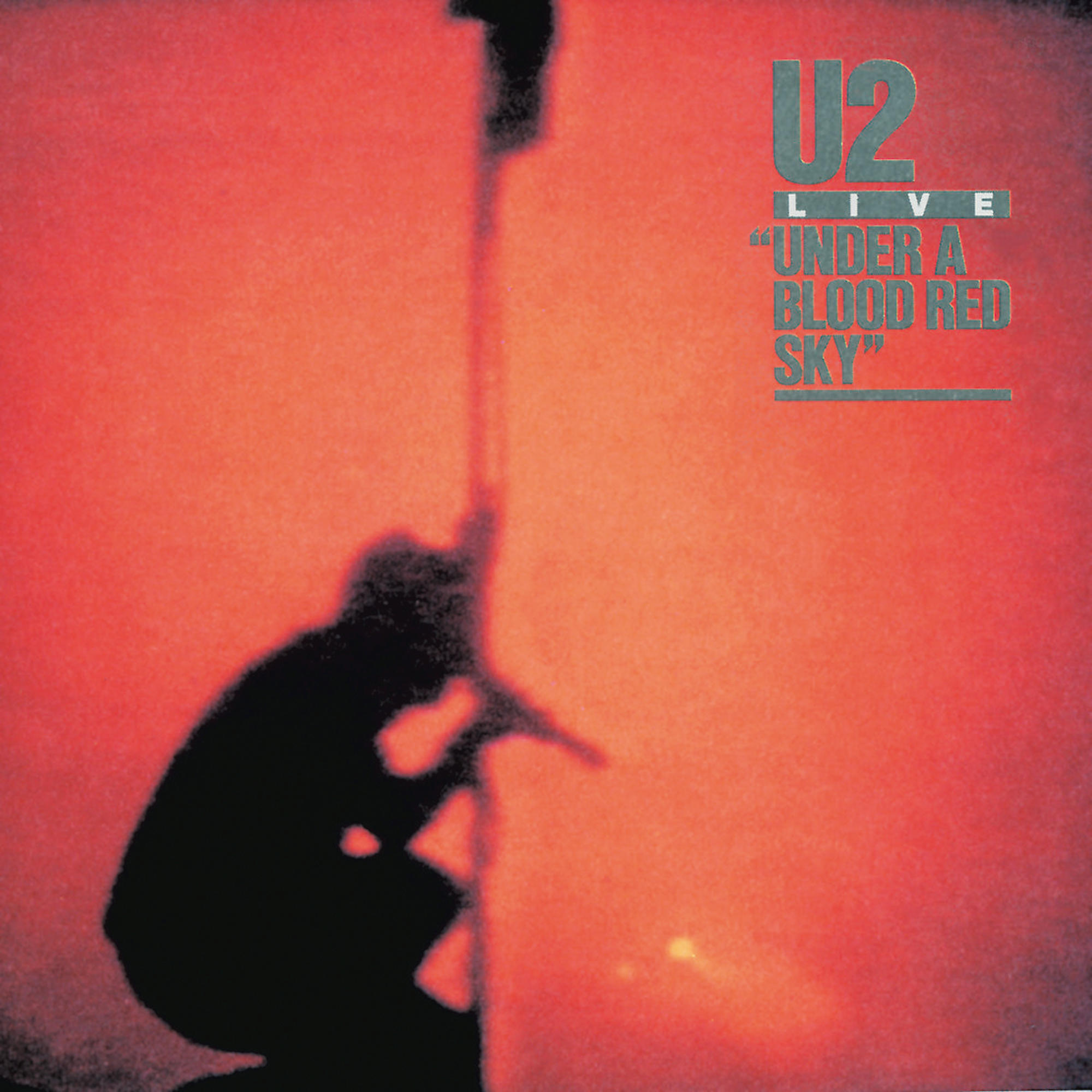 Silhouette einer Person vor rotem Hintergrund. U2 Live, Under a Blood Red Sky.