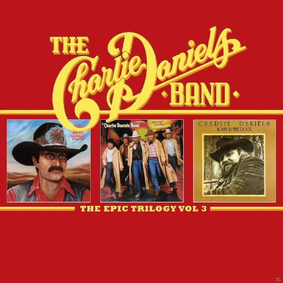 Album borítója három fotóval a Charlie Daniels Band-ről, piros háttérrel.