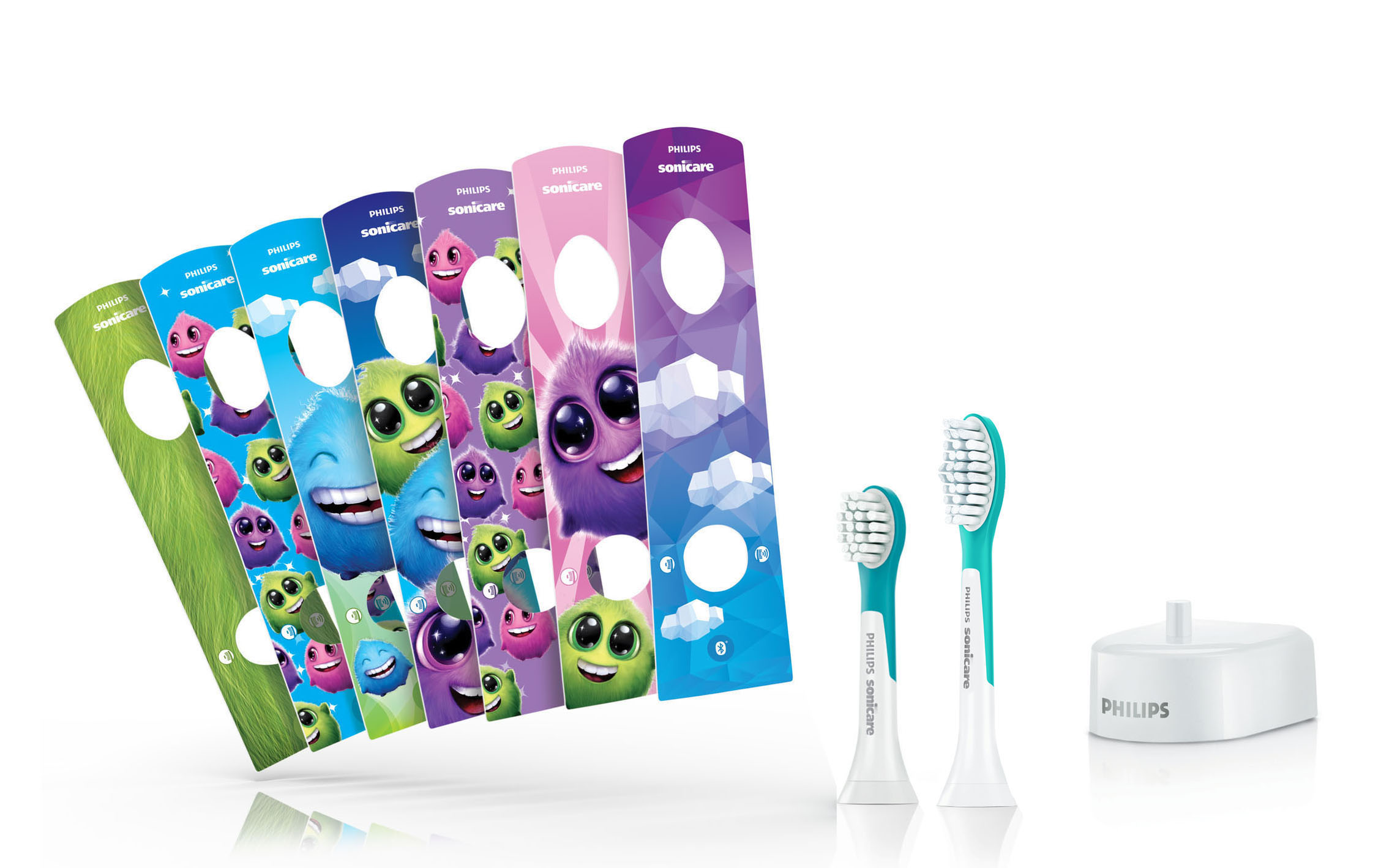 Ein Philips Sonicare-Zahnbürstenset mit Bürstenköpfen und einem Ladegerät sowie farbenfrohen, cartoonartigen Hüllen.