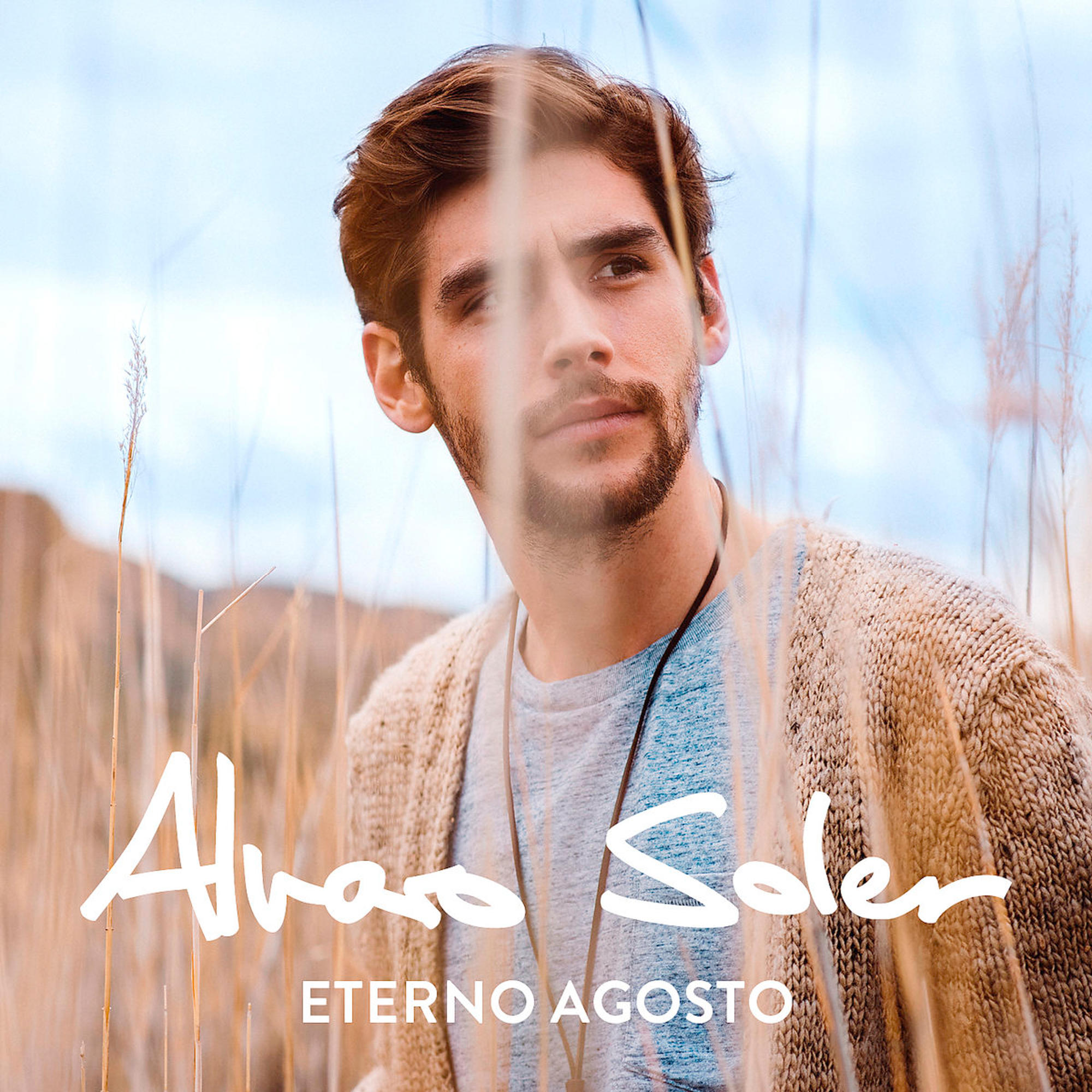 Albumcover. Ein Mann blickt in die Kamera, umgeben von Pflanzen. Der Titel ist in Weiß.