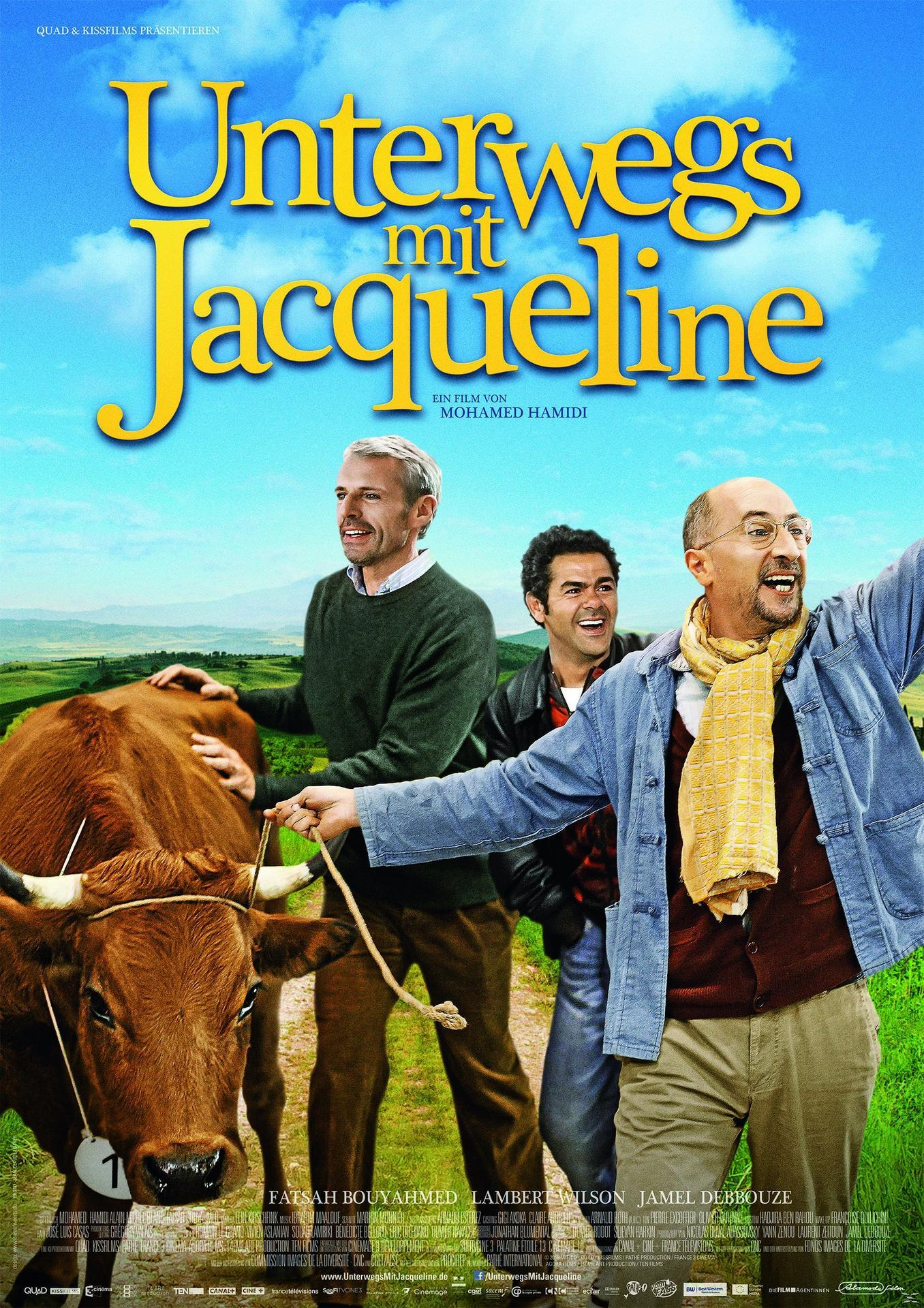 Filmplakat eines Films. Drei Männer mit einer Kuh auf einem Feld. Der Himmel ist blau mit weißen Wolken.