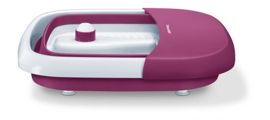 Un spa pour les pieds rose et blanc sur une surface blanche. Il a un intérieur blanc, un extérieur rose et un bouton blanc au milieu.