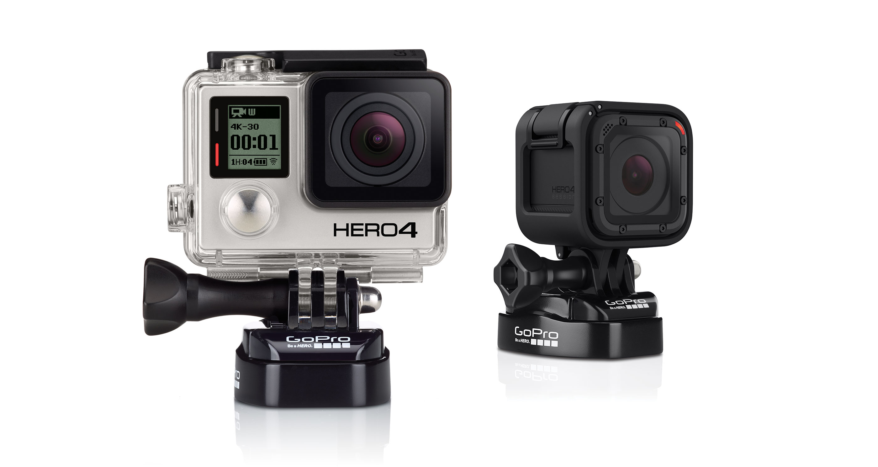 Two GoPro cameras on white background. One is silver with a screen, the other is black and square.
