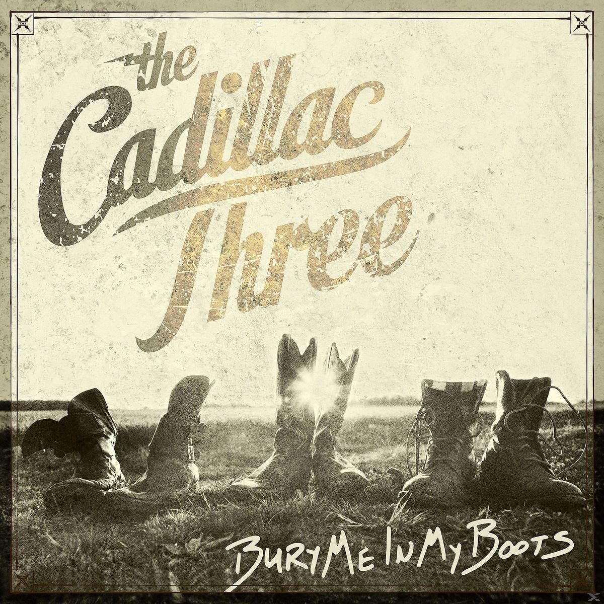 Albumcover mit Stiefeln, Text: 'The Cadillac Three' und 'Bury Me In My Boots'.